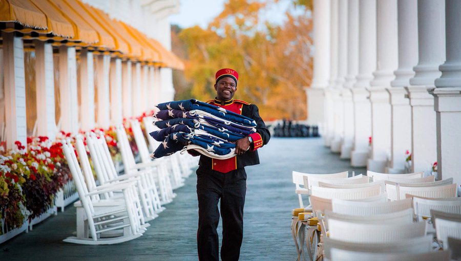 A bellman on the front porch of The Grand Hotel, Mackinac Island